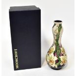 MOORCROFT; a tubeline decorated 'Gladioli' pattern gourd-shaped vase,