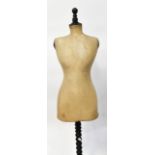 An early 20th century French dressmaker's mannequin, faded marks to the bottom,