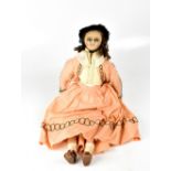 A 19th century wax doll with painted features, open eyes, material filled body, wax limbs,