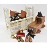 A scratch-built dolls' wooden cradle with hood,
