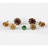 A pair of 9ct yellow gold stud earrings floral set with garnets,