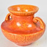 ROYAL LANCASTRIAN; a late 19th century art pottery urn-shaped short vase with dappled orange glaze,