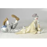 LLADRÓ; a large figure of a reclining clown with foot on circus ball, length approx 39cm.