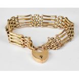 A 9ct gold rose gold four bar gate bracelet united with 9ct gold heart-shaped padlock clasp,