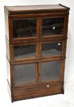 An early 20th century mahogany three-section stacking bookcase,