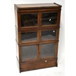 An early 20th century mahogany three-section stacking bookcase,