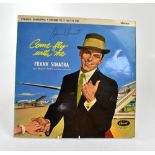 FRANK SINATRA; 'Come Fly with Me', an album bearing the megastar's signature to the front cover.