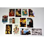 JAMES BOND; a collection of promotional 007 cards bearing signatures, to include Roger Moore (x3),