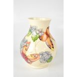 MOORCROFT; a cream ground tube lined baluster vase in 'Butterfly' design,
