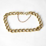A 9ct yellow gold link chain bracelet with safety chain, approx 29g.