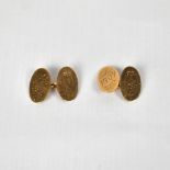 A pair of 9ct gold oval cufflinks, with engraved initials and dated 1907, approx 9g.