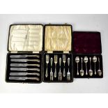 A cased set of silver-handled pistol grip butter knives, Elkington & Co,