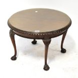 An early 20th century mahogany circular side table with moulded rim,