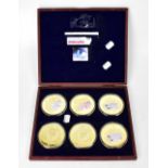 Six gold plated commemorative medallions for British banknotes, in a presentation case.