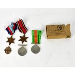 Four WWII medals relating to D Checkland, comprising the Defence Medal, Victory Medal,