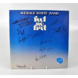 AVERAGE WHITE BAND; 'Feel No Fret', an album bearing numerous signatures to the front and back.