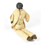 A 19th century black doll with Bakelite or vulcanised rubber head, with well groomed hair,