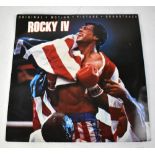 ROCKY; a Rocky IV soundtrack bearing the signatures of Sylvester Stallone and Carol Weathers verso.