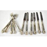 Six hallmarked silver handled dessert knives and forks, marks rubbed.