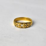 A Victorian 22ct yellow gold ring set with three diamonds in starburst setting, size T1/2, approx 5.