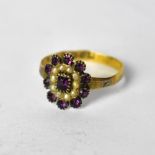 A Victorian 18ct yellow gold ladies' dress ring, floral set with central amethyst,