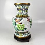 A large white ground cloisonné vase decorated with peonies, birds and butterflies,
