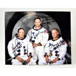 SPACE EXPLORATION; a coloured photograph bearing the signatures of Neil Armstrong,