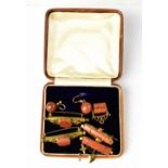 Four early 20th century yellow metal bar brooches, each set with Chinese goldstone,