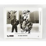 PUBLIC ENEMY; a black and white photograph bearing the signatures of the three band members,