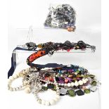 A quantity of modern and vintage costume jewellery to include necklaces, brooches, earrings,