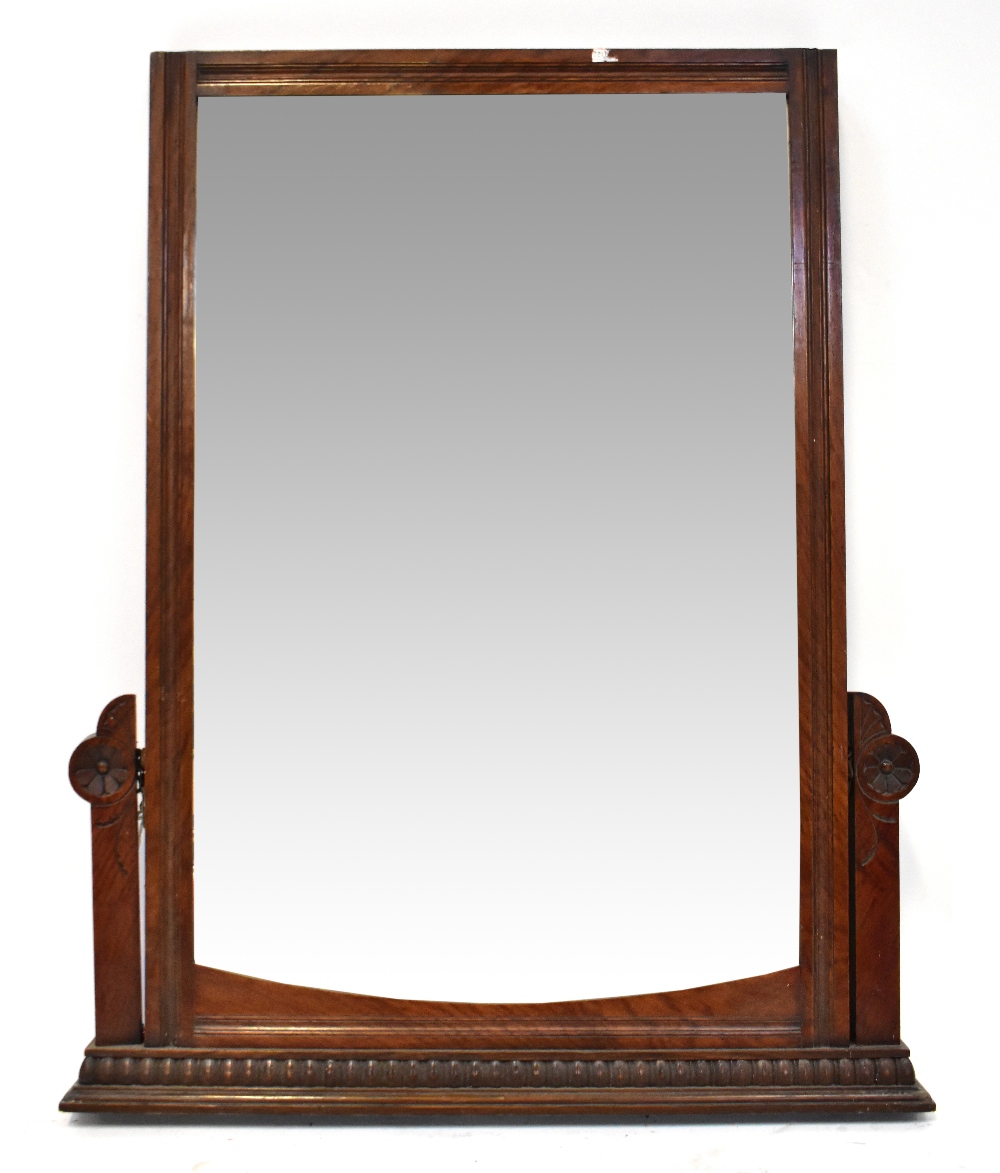 An Edwardian mahogany framed swing dressing chest mirror converted to a wall-hanging mirror,