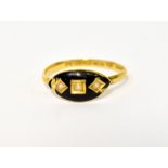 A 22ct mourning ring set with seed pearls in a black enamelled surround, stamped '22', size N,