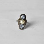 A white metal Art Deco dress ring with central pearl and blue stone to either side, size M,