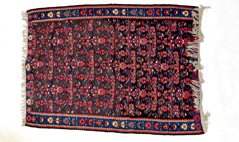 An Afghan rug with all-over floral decoration within stepped geometric border, 150 x 120cm.