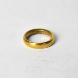 A 22ct yellow gold wedding band, size L, approx 9g.