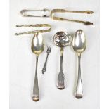 A pair of George III hallmarked silver dessert spoons, a Victorian ladle,