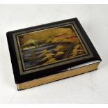 An early 20th century lacquered concertina style postcard album centred with a gilt-heightened