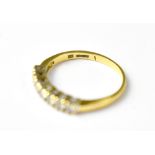 A 9ct gold half eternity ring with seven claw set diamonds, approx 0.5ct, size Q, approx 2.6g.