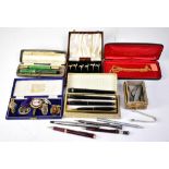 A quantity of vintage fountain, ink and ballpoint pens, a case containing four black pens,