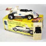 A Radio Shack radio controlled Formula One racing car, in original box with instructions.