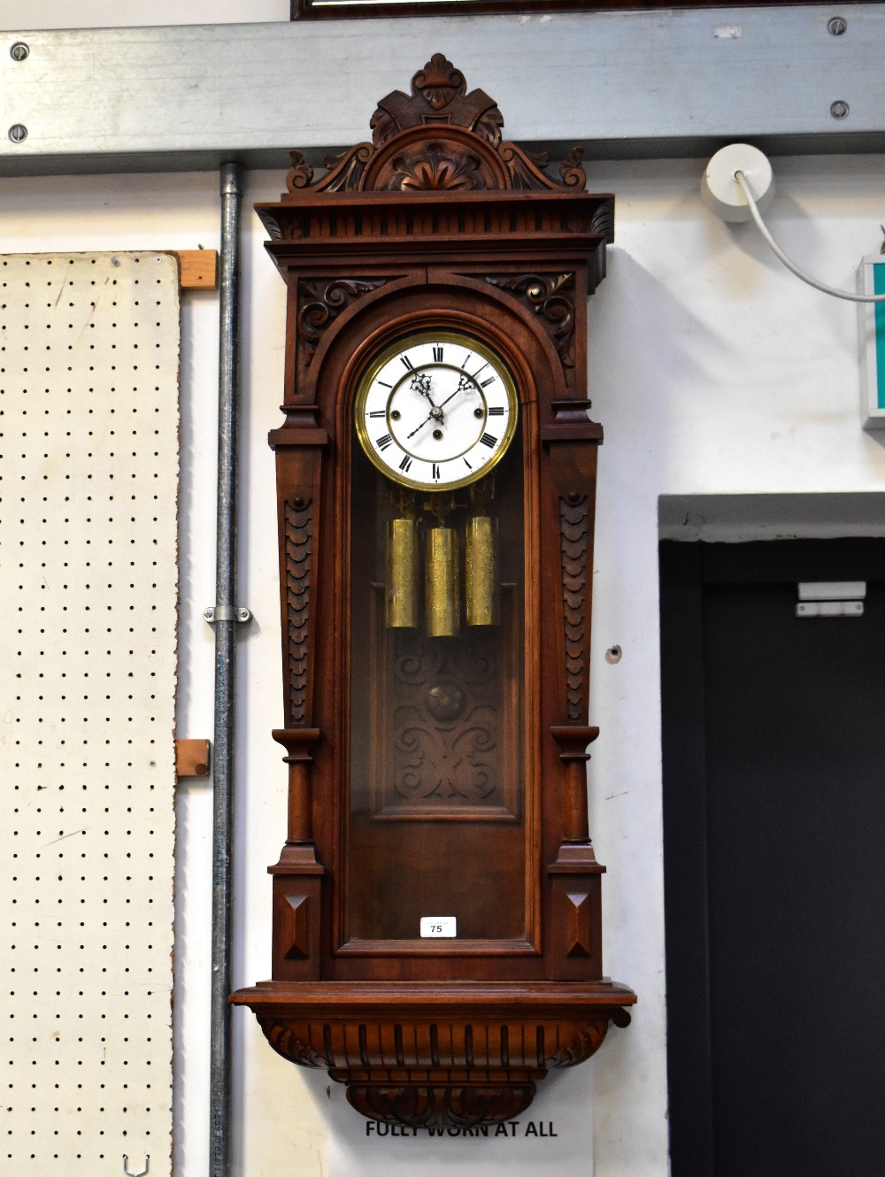 An early 20th century walnut cased triple weight Vienna wall clock,