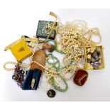 A quantity of mainly vintage costume jewellery to include faux pearl necklaces,