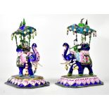 A pair of decorative Indian white metal and enamelled elephants, with howdah and figures,
