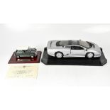 MAISTO; a 1:12 scale model Jaguar XJ220 1992, boxed, together with a model of a 1275 Mini Cooper S,