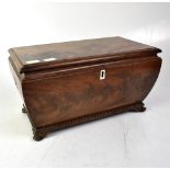 A 19th century mahogany tea caddy of tapering form,