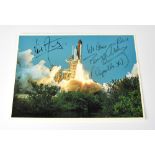 SPACE EXPLORATION; a postcard bearing the signatures of Buzz Aldrin and Neil Armstrong.