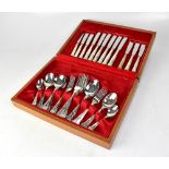 A six-setting canteen of silver plated cutlery in a red lined mahogany canteen.