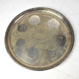 An Elizabeth II hallmarked silver circular tray, with personal dedication to the edge dated 1974,