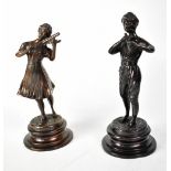 A pair of bronze figures, a young man and woman playing musical instruments, raised on socle bases,