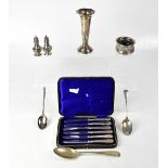 A cased set of six hallmarked silver non-matching fruit and butter knives,